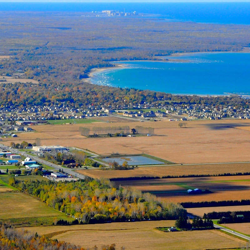 An aerial photograph of Saugeen Shores community with Bruce Power visible in the far background